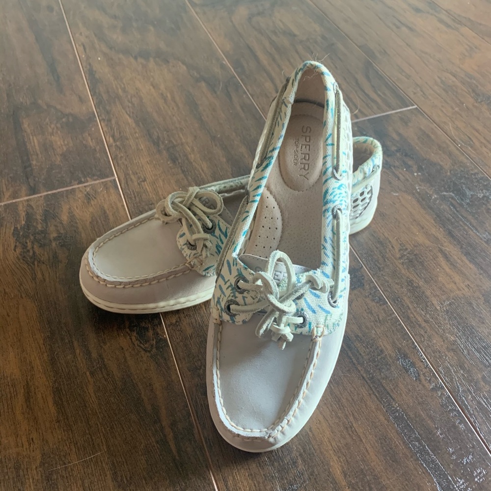 Tan Sperry’s with detail and mesh sides.